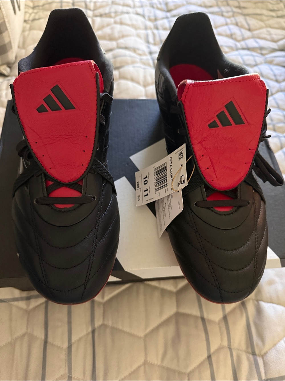 adidas Black Soccer Cleats with Red Tongue Accents